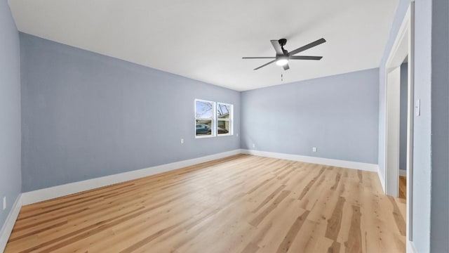 1112 Village Green Dr, Austin, TX 78753 - empty room with a ceiling fan, light wood-style floors, and baseboards