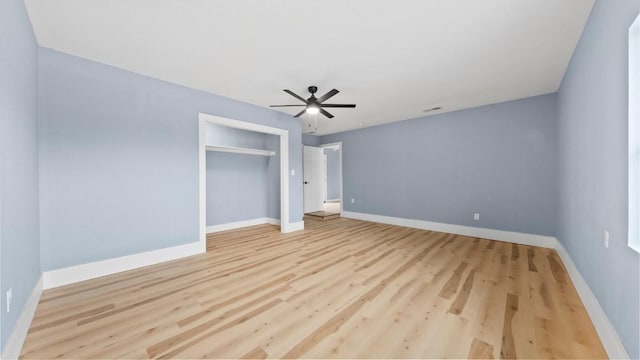 1112 Village Green Dr, Austin, TX 78753 - unfurnished bedroom with wood finished floors, baseboards, a ceiling fan, and a closet