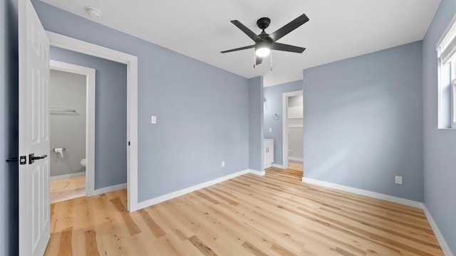 1112 Village Green Dr, Austin, TX 78753 - unfurnished bedroom with light wood-style floors, baseboards, and a ceiling fan