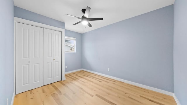 1112 Village Green Dr, Austin, TX 78753 - unfurnished bedroom with wood finished floors, baseboards, a closet, and a ceiling fan
