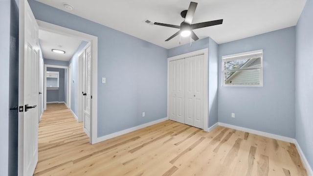 1112 Village Green Dr, Austin, TX 78753 - unfurnished bedroom with wood finished floors, baseboards, a closet, and ceiling fan