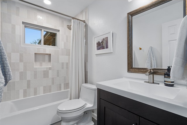 full bathroom featuring toilet, shower / bath combination with curtain, and vanity