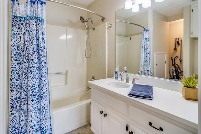 full bathroom featuring shower / bath combo with shower curtain and vanity