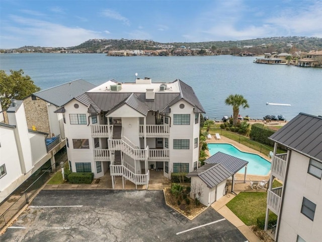 birds eye view of property with a water view