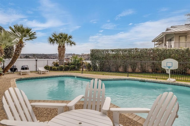 view of swimming pool with fence and a fenced in pool