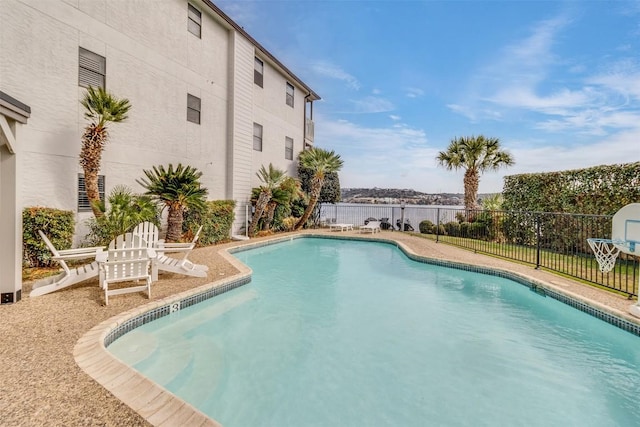 view of pool featuring a fenced in pool and fence