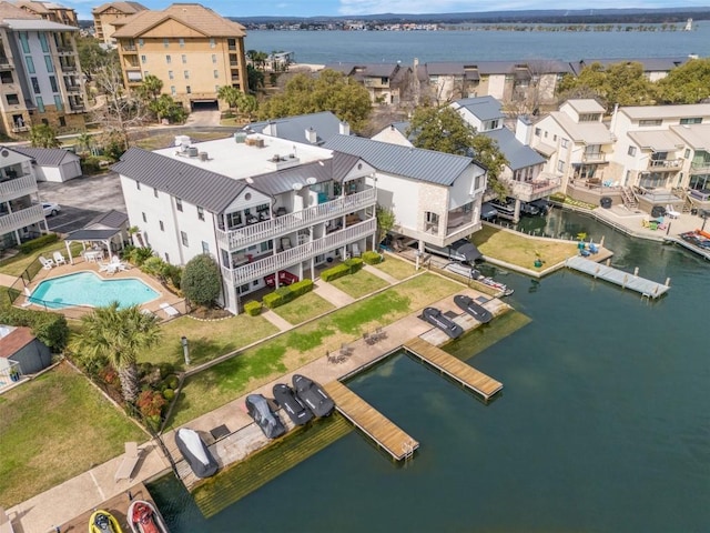 birds eye view of property with a residential view and a water view