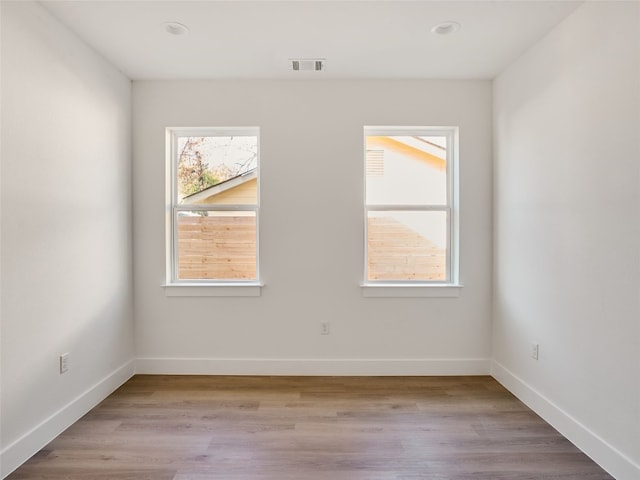 1002 Gullett St Unit 2, Austin, TX 78702 - spare room with baseboards and light wood-style flooring