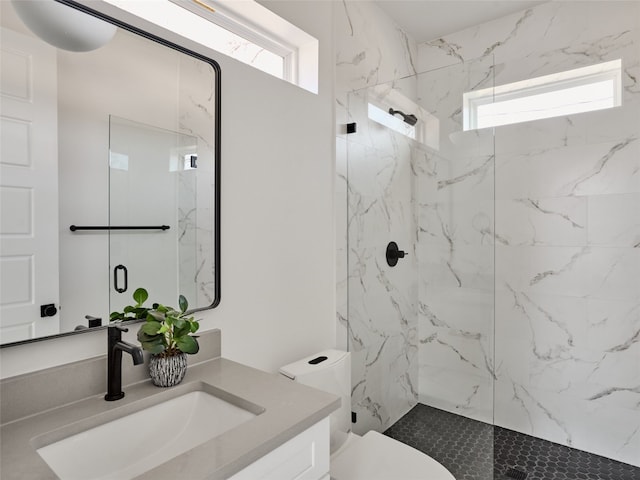 1002 Gullett St Unit 2, Austin, TX 78702 - bathroom featuring a marble finish shower, vanity, and toilet