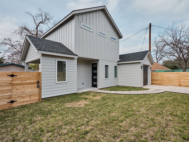 1002 Gullett St Unit 2, Austin, TX 78702 - back of house with board and batten siding, roof with shingles, and a garage