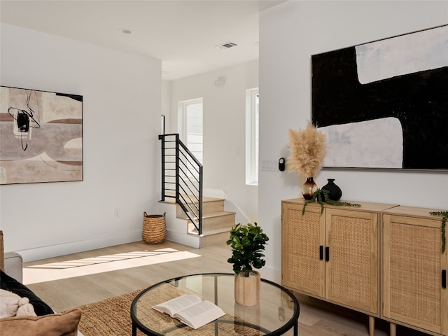 1002 Gullett St Unit 2, Austin, TX 78702 - living room featuring wood finished floors, stairs, and baseboards