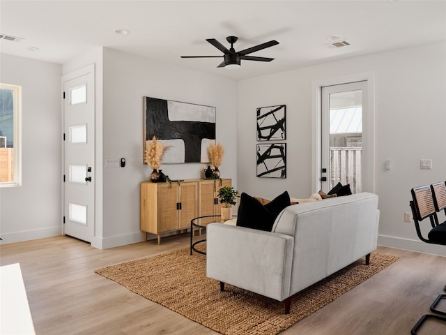 1002 Gullett St Unit 2, Austin, TX 78702 - living area featuring light wood-style flooring, baseboards, and ceiling fan