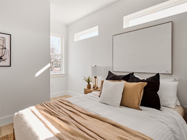 1002 Gullett St Unit 2, Austin, TX 78702 - bedroom featuring baseboards and wood finished floors