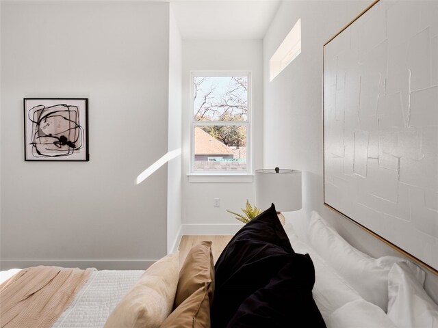 1002 Gullett St Unit 2, Austin, TX 78702 - bedroom with baseboards and wood finished floors