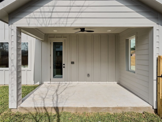 1002 Gullett St Unit 2, Austin, TX 78702 - doorway to property with board and batten siding, a ceiling fan, and a patio