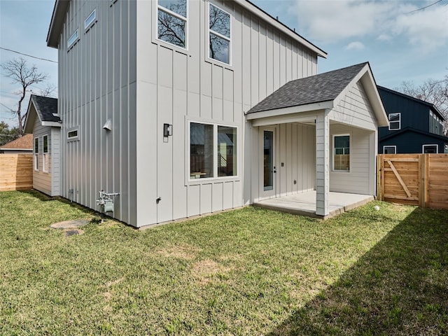 1002 Gullett St Unit 2, Austin, TX 78702 - back of property featuring a patio area, board and batten siding, and roof with shingles