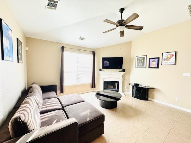 living room with lofted ceiling, a fireplace, and visible vents