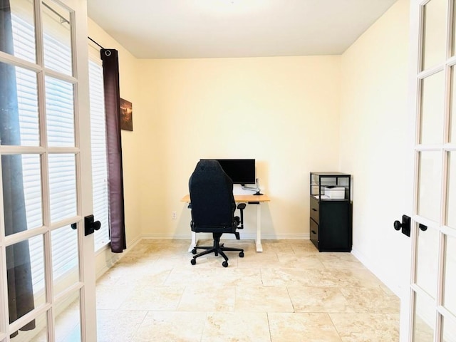 home office featuring baseboards and french doors