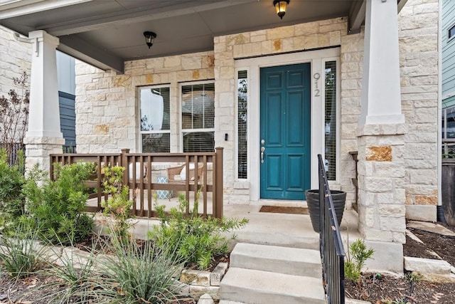 view of exterior entry with stone siding