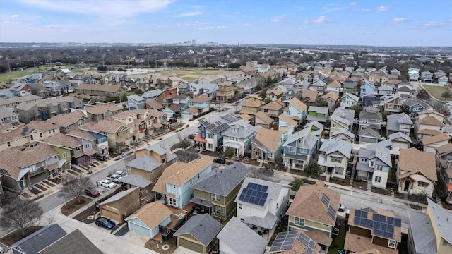 birds eye view of property with a residential view