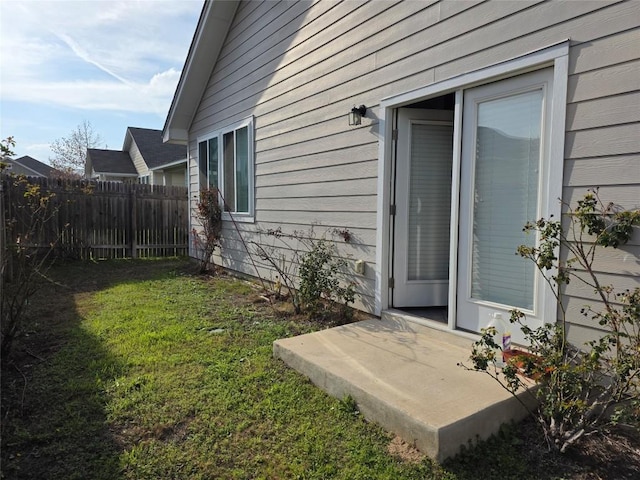 view of yard featuring fence and a patio