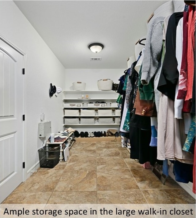 walk in closet featuring visible vents