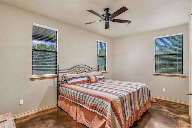 542 Stars And Stripes, Fischer, TX 78623 - bedroom with a ceiling fan, concrete flooring, and baseboards