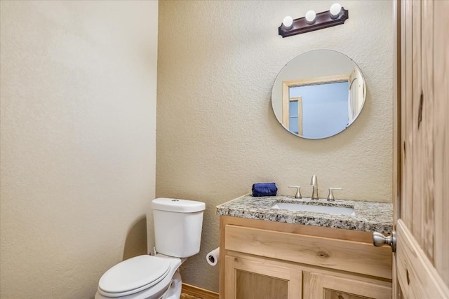 542 Stars And Stripes, Fischer, TX 78623 - bathroom featuring toilet, vanity, and a textured wall