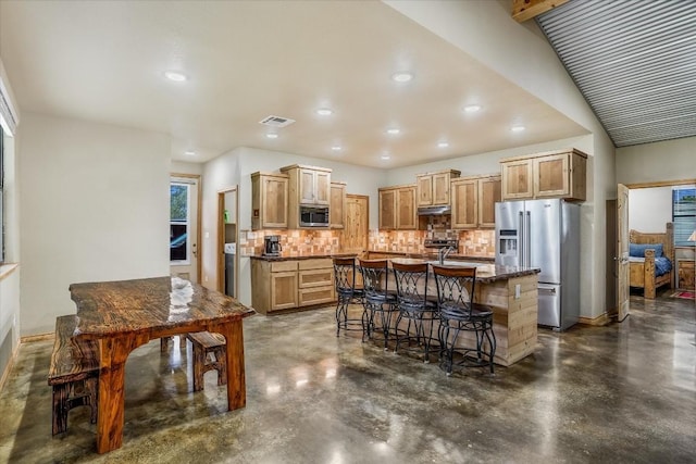 542 Stars And Stripes, Fischer, TX 78623 - kitchen featuring finished concrete flooring, tasteful backsplash, appliances with stainless steel finishes, and under cabinet range hood
