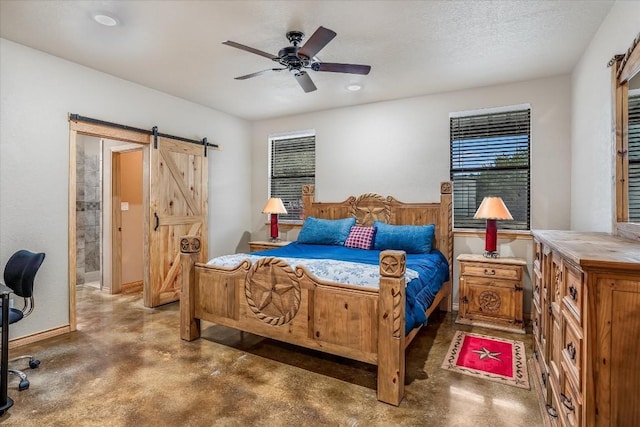 542 Stars And Stripes, Fischer, TX 78623 - bedroom featuring a ceiling fan, finished concrete flooring, a barn door, and baseboards