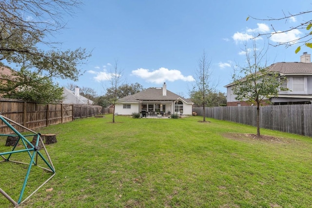 view of yard with a fenced backyard and a patio