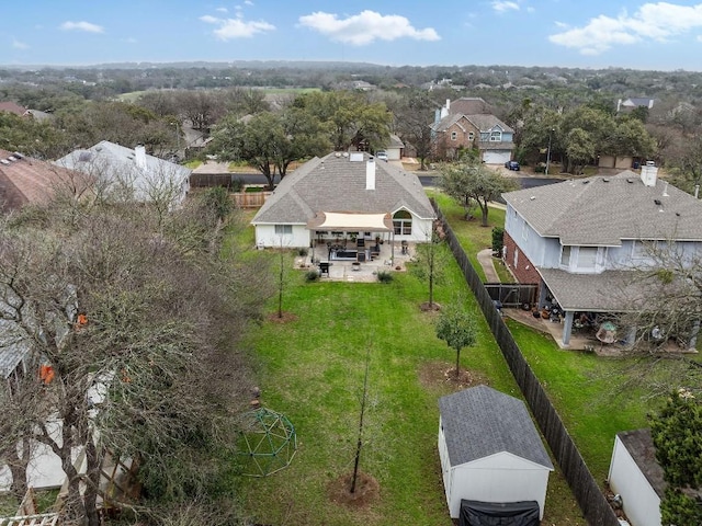 birds eye view of property with a residential view