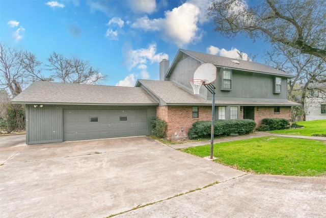 traditional-style home with a garage, brick siding, a chimney, and a front yard