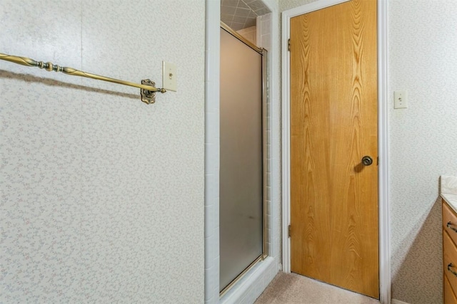 full bath featuring a stall shower and vanity