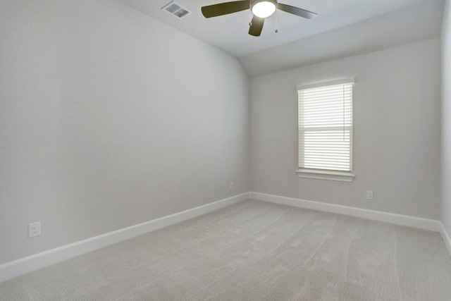 unfurnished room featuring baseboards, visible vents, and light colored carpet