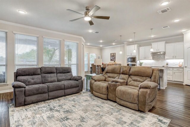 1330 Logan Blvd, Salado, TX 76571 - living room featuring a ceiling fan, dark wood finished floors, crown molding, recessed lighting, and baseboards