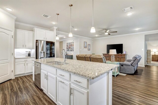 1330 Logan Blvd, Salado, TX 76571 - kitchen featuring a sink, stainless steel appliances, crown molding, dark wood finished floors, and ceiling fan