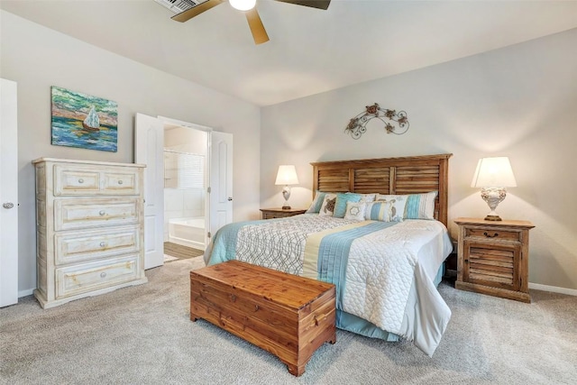 1330 Logan Blvd, Salado, TX 76571 - bedroom with light colored carpet, ensuite bath, ceiling fan, and baseboards