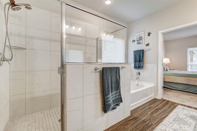 1330 Logan Blvd, Salado, TX 76571 - ensuite bathroom with a shower stall, wood finished floors, and a bath