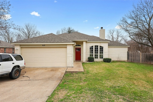 ranch-style house with an attached garage, a chimney, a front lawn, and brick siding