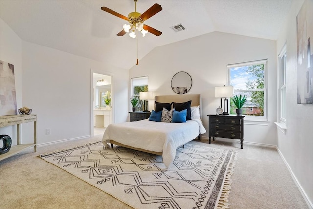 bedroom with light carpet, lofted ceiling, visible vents, and baseboards