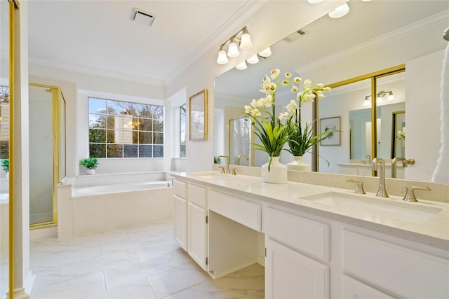 bathroom with marble finish floor, a garden tub, crown molding, visible vents, and a sink