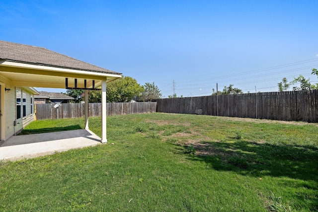 view of yard with a patio area and a fenced backyard