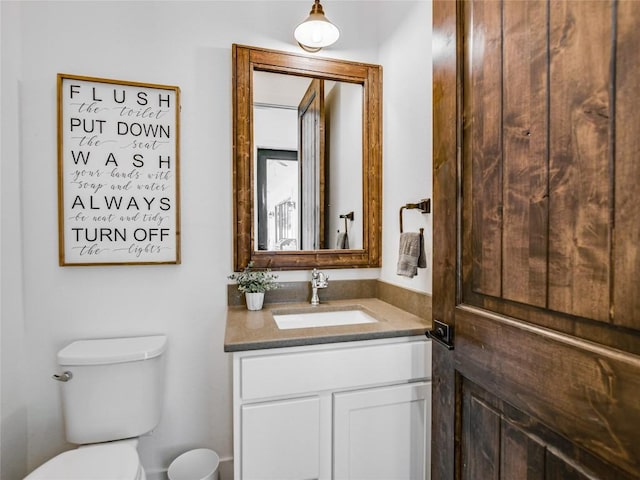 bathroom with vanity and toilet