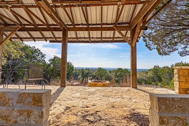 exterior space with a fire pit and a patio area