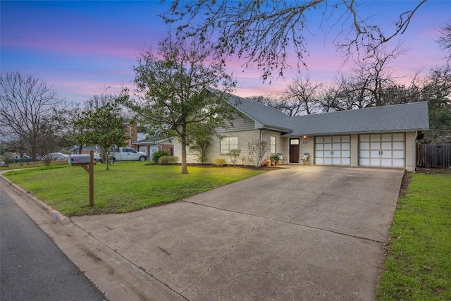 4608 Arapahoe Trl, Austin, TX 78745 - view of front of house featuring concrete driveway, a garage, and brick siding