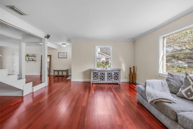 4608 Arapahoe Trl, Austin, TX 78745 - living area featuring plenty of natural light, stairs, wood finished floors, and crown molding