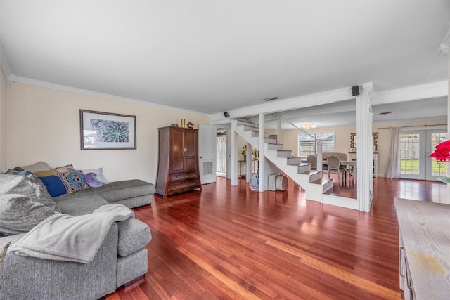 4608 Arapahoe Trl, Austin, TX 78745 - living area featuring crown molding, stairs, wood finished floors, and french doors