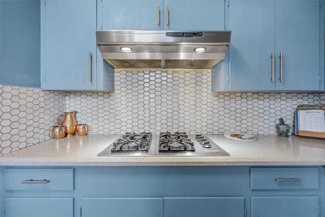 4608 Arapahoe Trl, Austin, TX 78745 - kitchen with extractor fan, stainless steel gas cooktop, blue cabinets, and backsplash