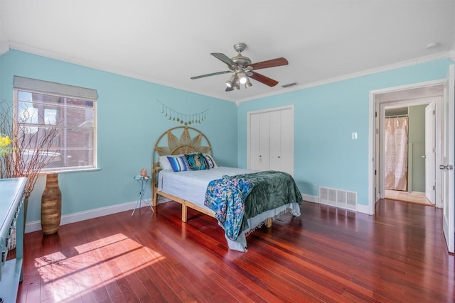 4608 Arapahoe Trl, Austin, TX 78745 - bedroom with crown molding, wood finished floors, a closet, and ceiling fan
